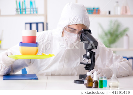 Chemist checking and testing plastic dishes Chemist checking and testing plastic dishes 41291439