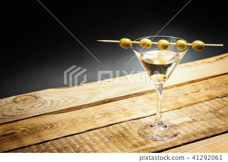 martini drink in a glass with olives on a stick martini drink in a glass with olives on a stick 41292061