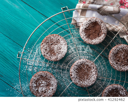 Chocolate winter muffins with icing sugar 41292462