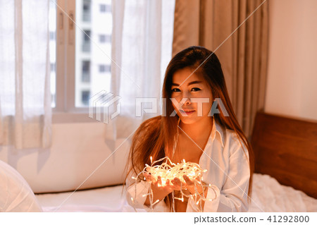 Sexy women concept. Sexy Asian girls are playing in the bedroom. 41292800