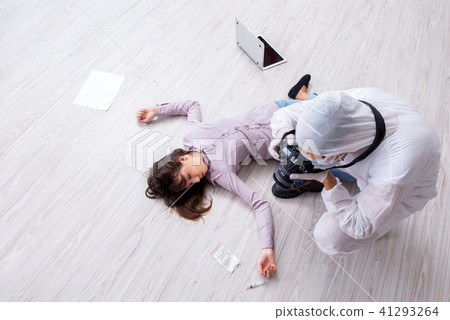 Forensic investigator at the crime scene investigating woman mur Forensic investigator at the crime scene investigating woman mur 41293264