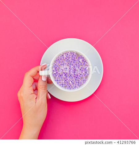 Cup of beautiful lilac flowers infused water 41293766