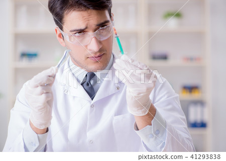 Expert criminologist working in the lab for evidence 41293838