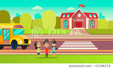 Pupils are near the school bus. School across the road. Transition in front of the school. Students 41296219
