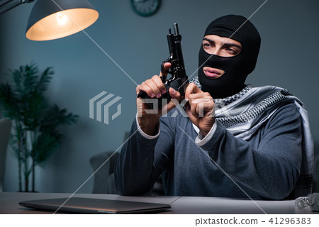 Terrorist burglar with gun asking for money ransom 41296383