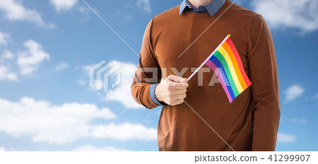 close up of man with gay pride rainbow flag 41299907