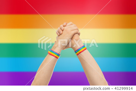 hands with gay pride wristbands in winning gesture hands with gay pride wristbands in winning gesture 41299914