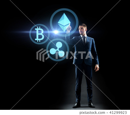 buisnessman with cryptocurrency holograms buisnessman with cryptocurrency holograms 41299923