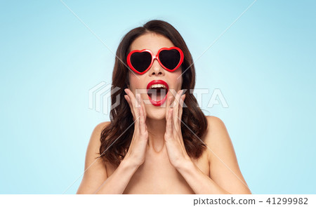 woman with red lipstick and heart shaped shades 41299982