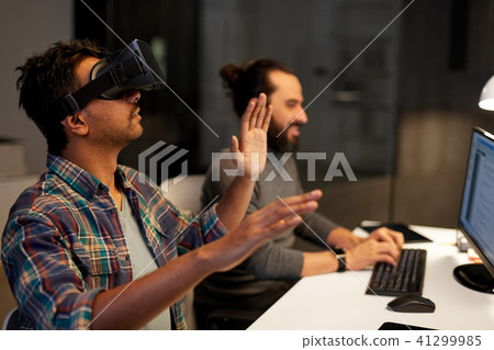 creative man in virtual reality headset at office creative man in virtual reality headset at office 41299985