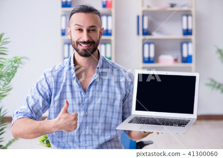 Young designer working in his studio on new project 41300060