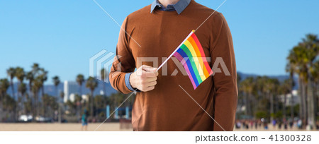 close up of man with gay pride rainbow flag 41300328