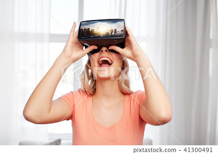 woman in virtual reality headset or 3d glasses woman in virtual reality headset or 3d glasses 41300491