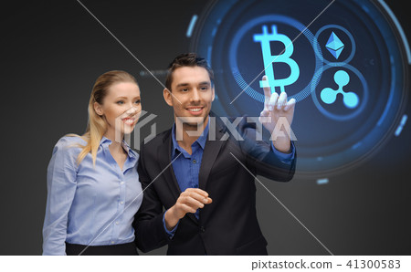 businesspeople with cryptocurrency holograms 41300583