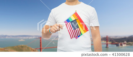 man with gay pride rainbow flag and wristband 41300628