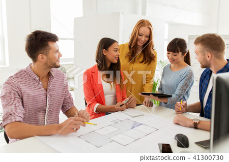 creative team with blueprint working at office creative team with blueprint working at office 41300730