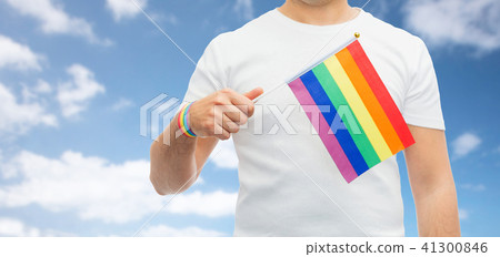 man with gay pride rainbow flag and wristband 41300846