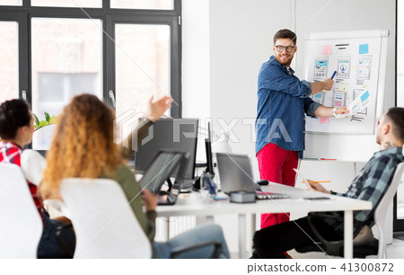 creative man showing user interface at office 41300872