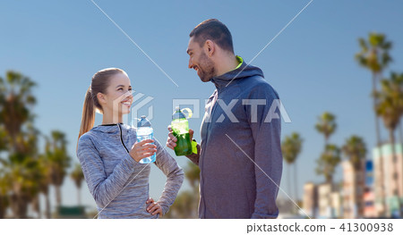 couple of sportsmen with water over venice beach 41300938