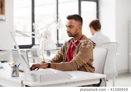 indian man with laptop computer at office 41300939