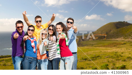 happy friends pointing at you over big sur coast happy friends pointing at you over big sur coast 41300965