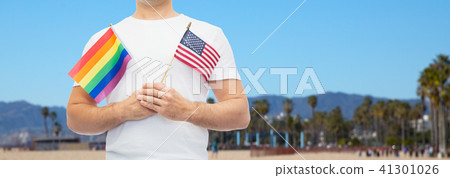 man with gay pride rainbow flag and american 41301026