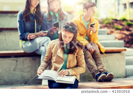 high school student girl reading book outdoors high school student girl reading book outdoors 41301058