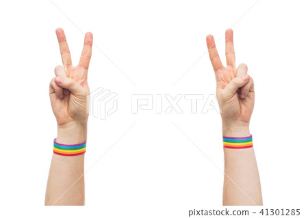 hands with gay pride rainbow wristbands make peace 41301285