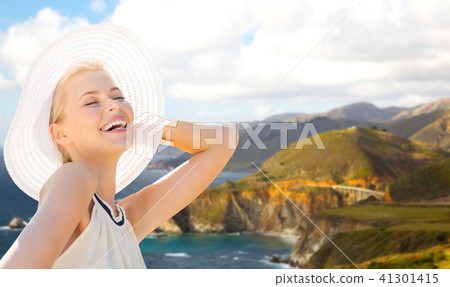 woman over bixby creek bridge on big sur coast 41301415