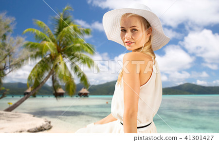 beautiful woman enjoying summer over beach beautiful woman enjoying summer over beach 41301427