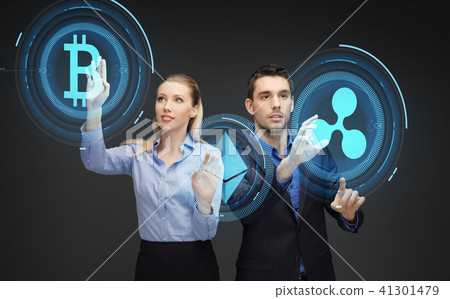 businesspeople with cryptocurrency holograms businesspeople with cryptocurrency holograms 41301479