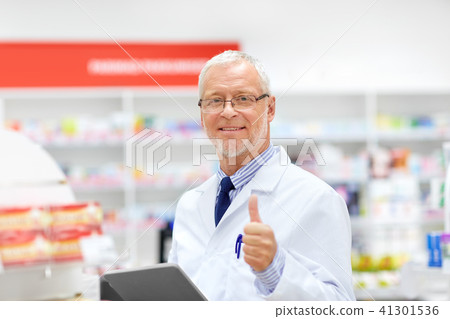 senior with tablet pc at pharmacy senior with tablet pc at pharmacy 41301536