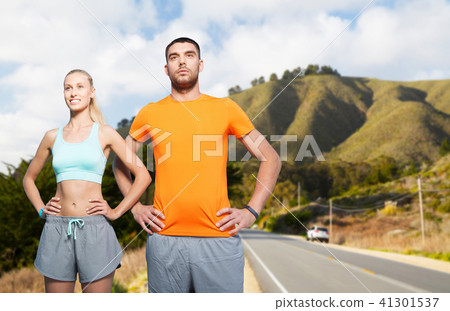 happy couple doing sports over big sur hills happy couple doing sports over big sur hills 41301537
