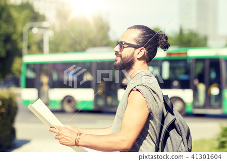 man traveling with backpack and map in city man traveling with backpack and map in city 41301604