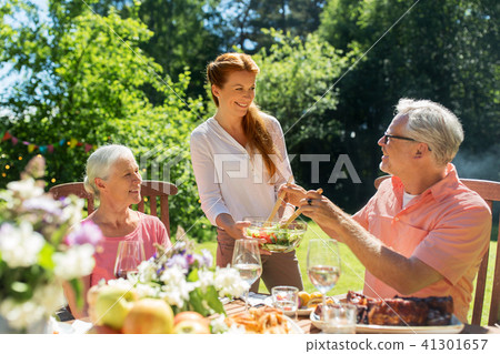 happy family having dinner or summer garden party happy family having dinner or summer garden party 41301657