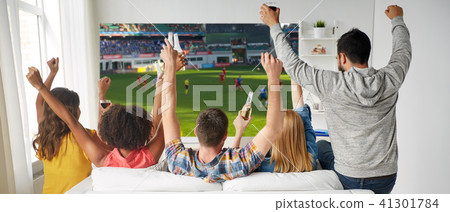friends drinking beer and watching soccer game friends drinking beer and watching soccer game 41301784