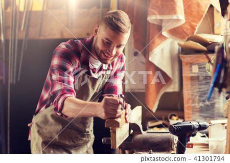 carpenter working with plane and wood at workshop carpenter working with plane and wood at workshop 41301794