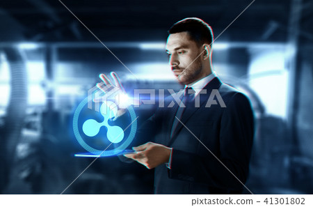 businessman with tablet pc and ripple hologram 41301802