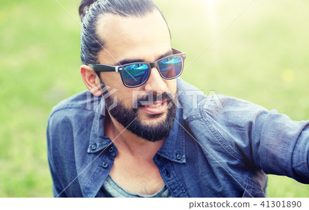 man in sunglasses at city street or park man in sunglasses at city street or park 41301890