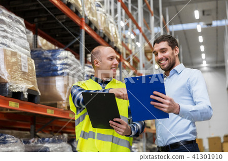 worker and businessman with clipboard at warehouse 41301910