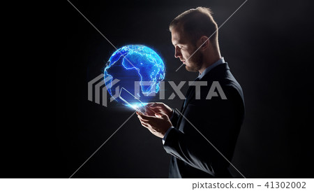 businessman with tablet pc and earth hologram 41302002