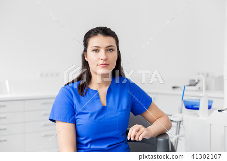 female dentist or nurse at dental clinic office female dentist or nurse at dental clinic office 41302107