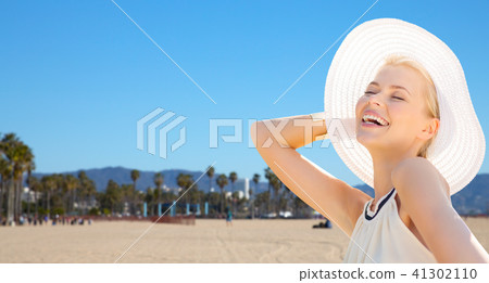 beautiful woman enjoying summer over venice beach 41302110