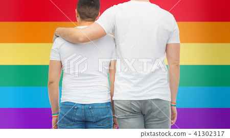male couple with gay pride rainbow wristbands 41302317