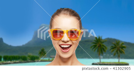 happy woman or teenage girl in sunglasses on beach happy woman or teenage girl in sunglasses on beach 41302905