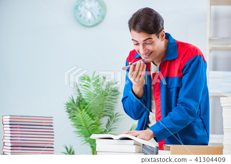 Worker in publishing house preparing book order Worker in publishing house preparing book order 41304409