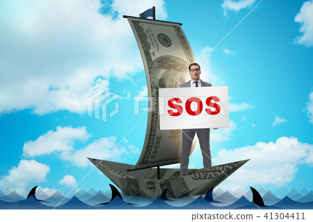 Businessman asking for help with SOS message on boat Businessman asking for help with SOS message on boat 41304411