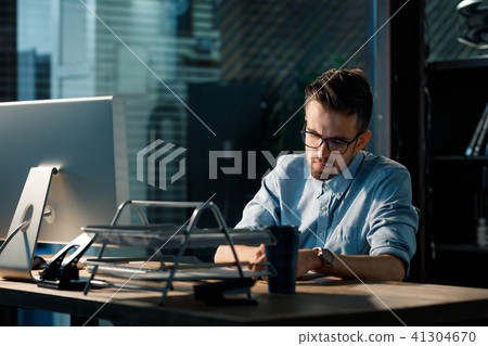 Man having overhours in office Man having overhours in office 41304670
