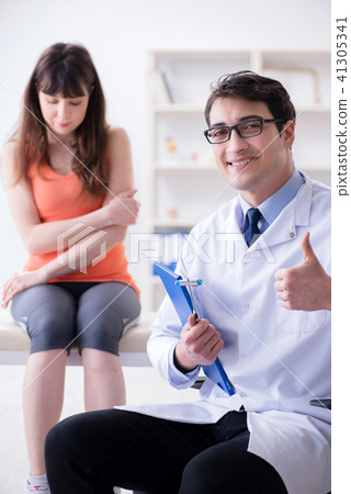 Doctor neurologist examining female patient 41305341