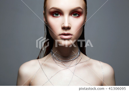 Beautiful Girl with makeup and silver thread 41306095